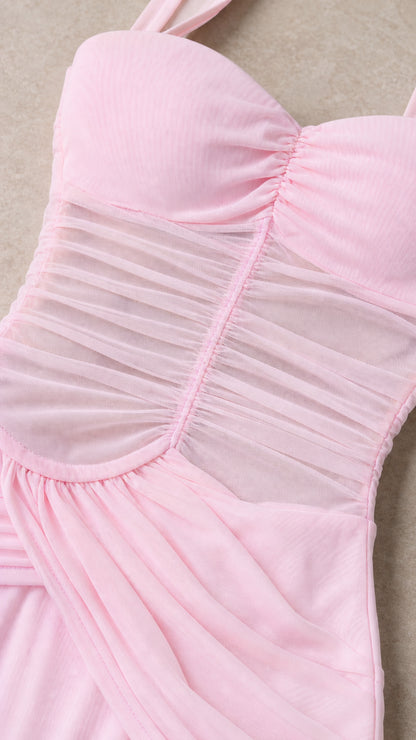 Close-up detail of sheer ruched mesh bodice on pink dress