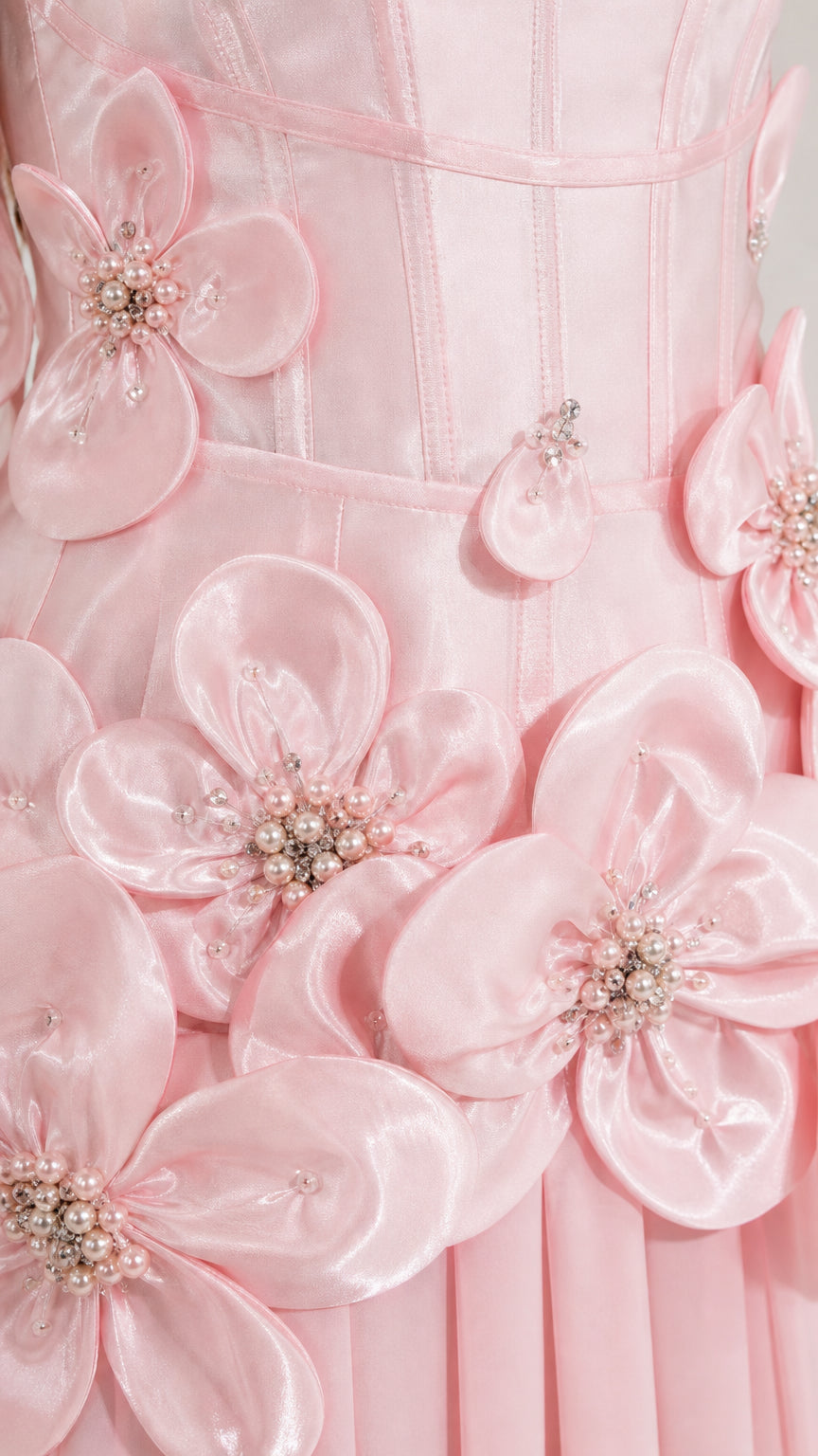 Close-up detail of dimensional floral appliques and beadwork