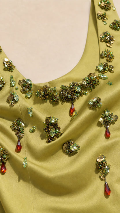 Close-up detail of beaded floral neckline and crystal accents