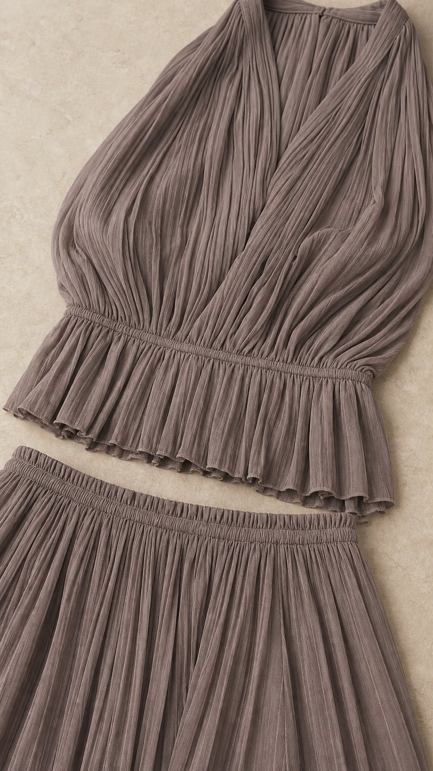 Flat lay close-up of taupe pleated fabric details