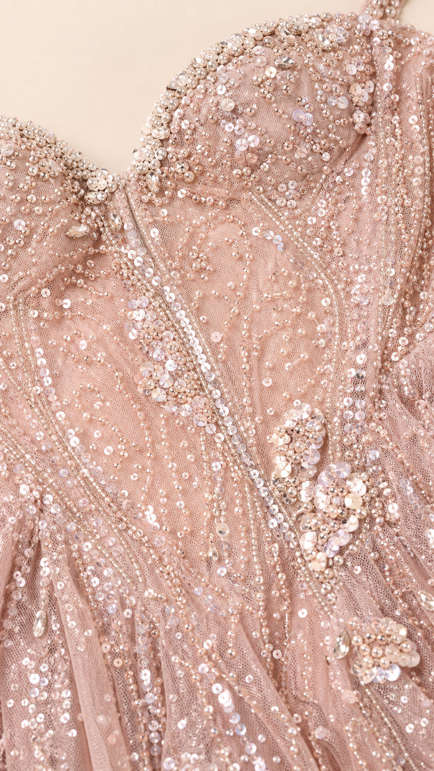 Close-up detail of the sweetheart neckline and bead embroidery