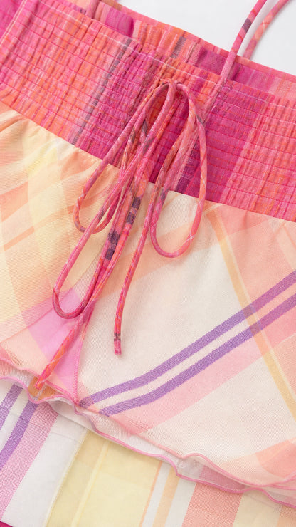 Close-up of pink plaid camisole bodice with drawstring ties