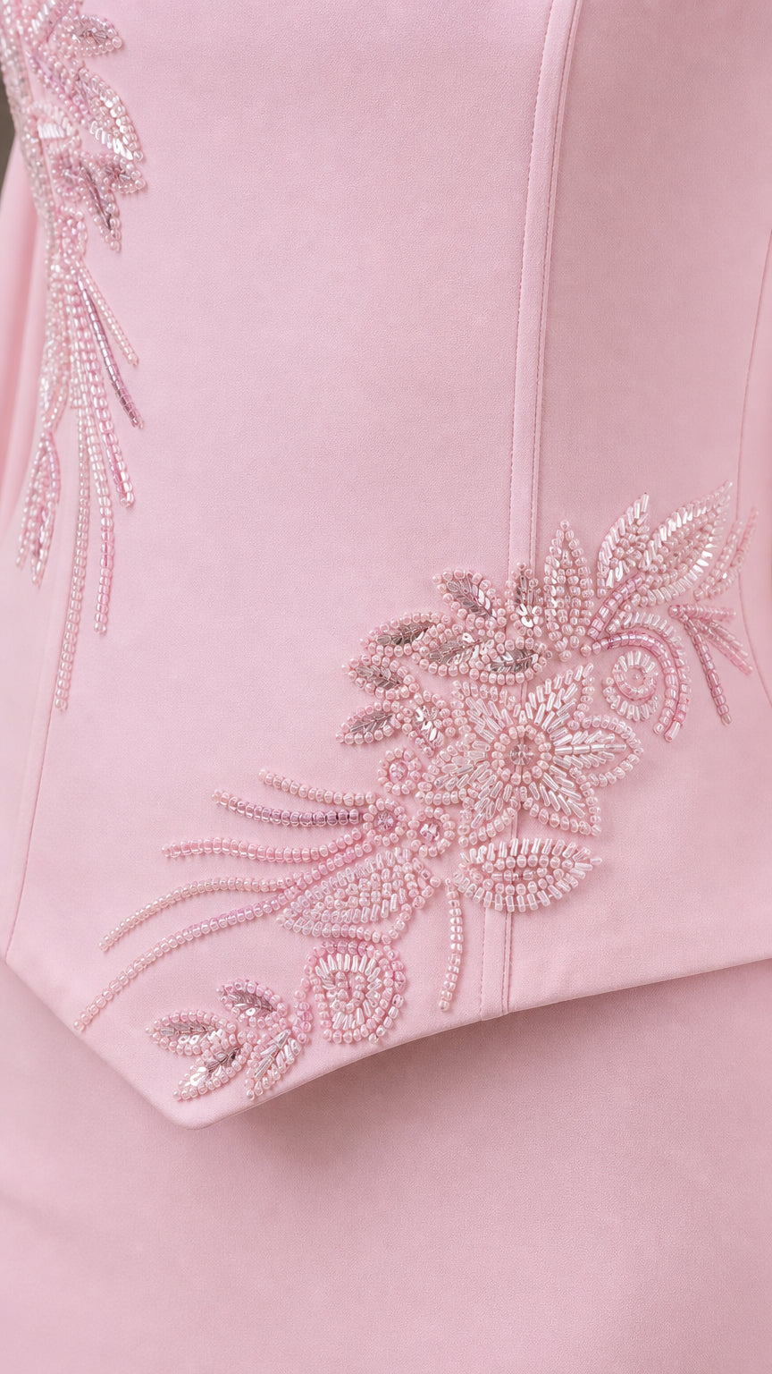 Close-up of delicate tonal floral beadwork and embroidery on bodice hem