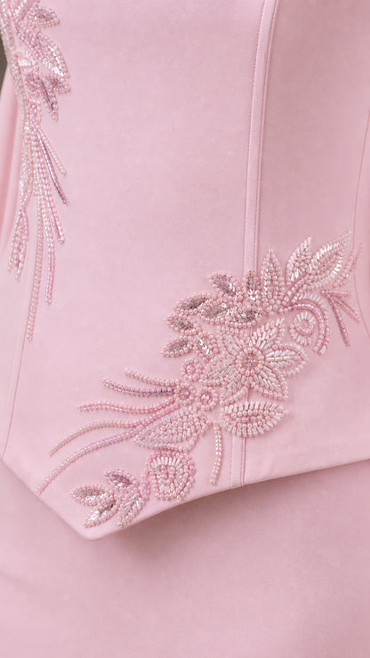 Close-up of delicate tonal floral beadwork and embroidery on bodice hem