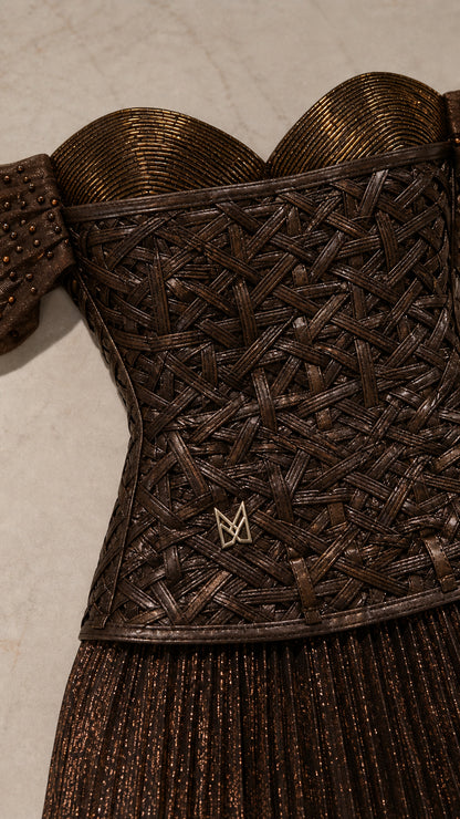 Close-up detail of woven-textured metallic corset bodice