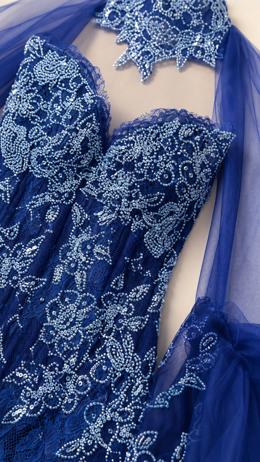 Close-up detail of sweetheart bodice and beadwork on royal blue gown