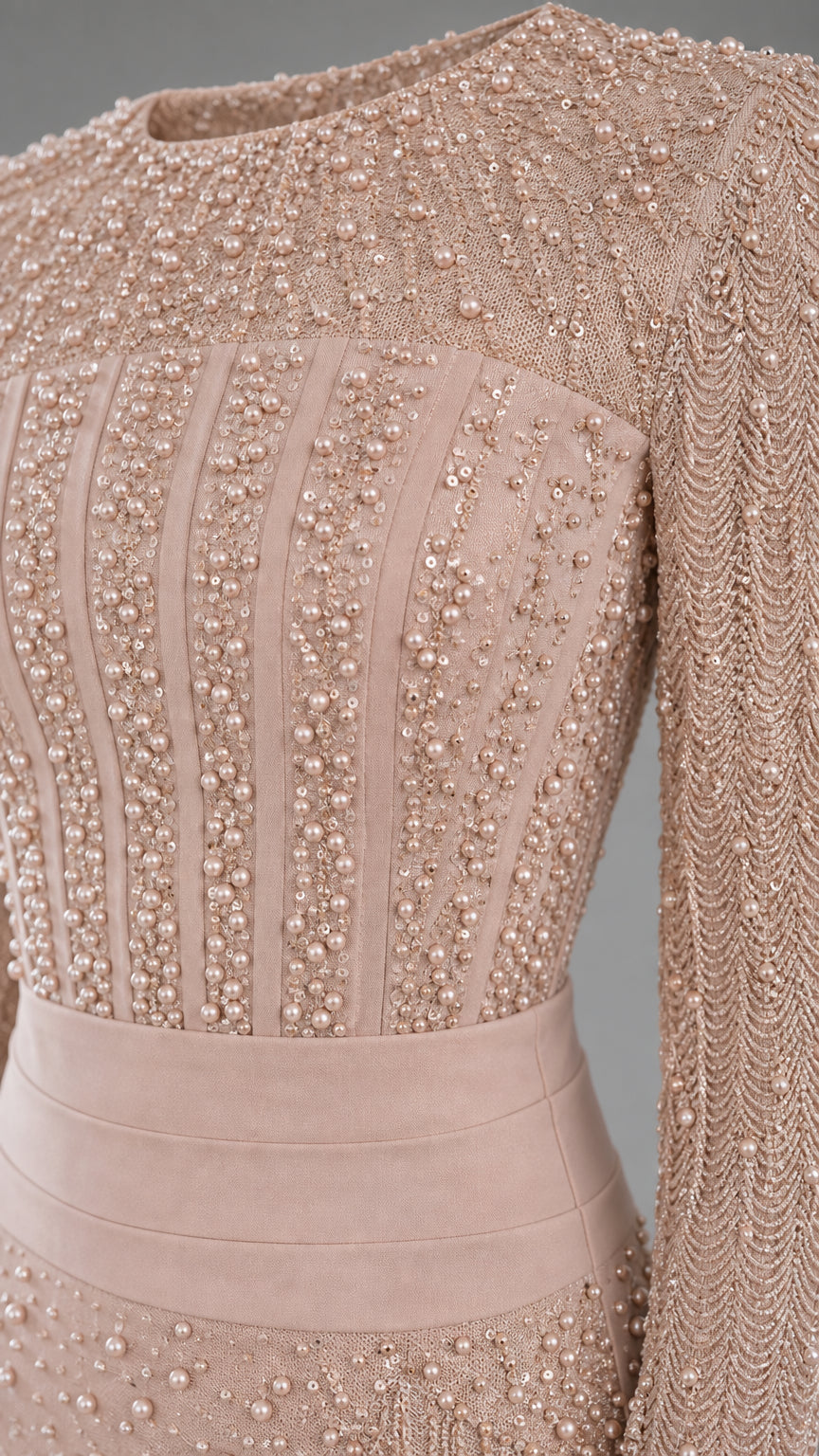 Close-up detail of the intricate beading and structured waistband