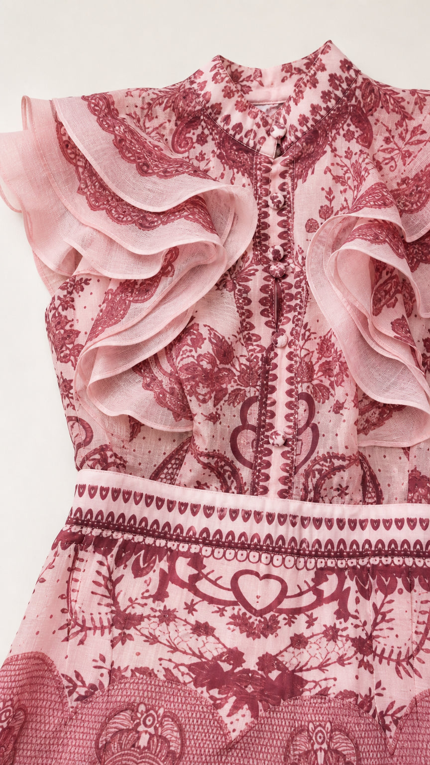 Close-up of ruffle shoulder and patterned bodice detail
