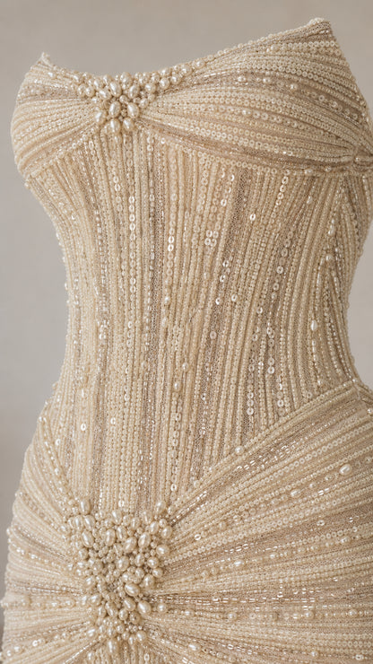 Close-up detail of bodice with pearl starburst and vertical sequin beading