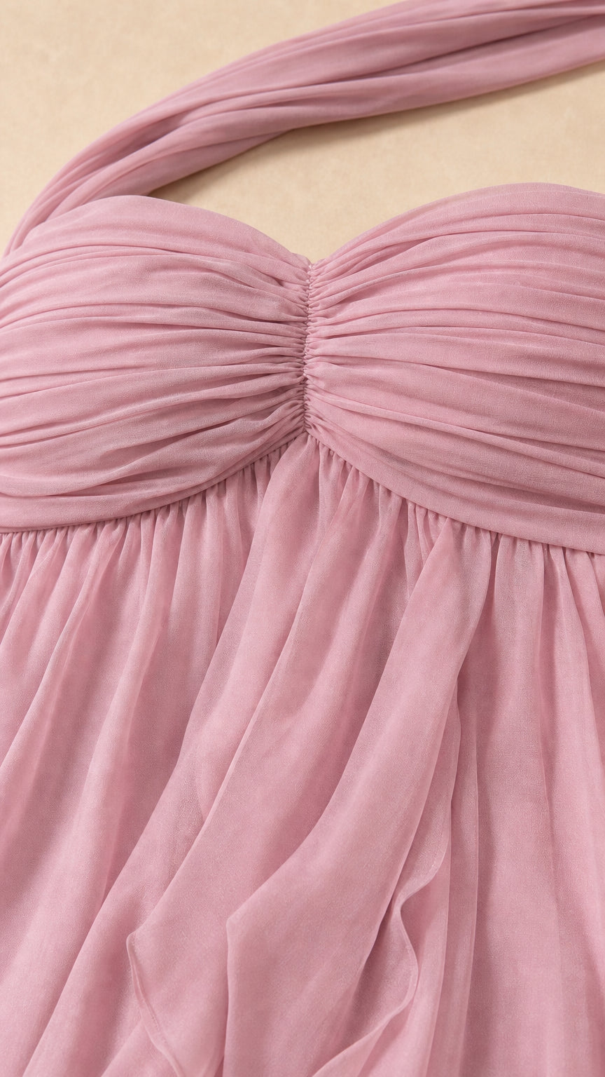 Close up of ruched sweetheart bodice and halter strap