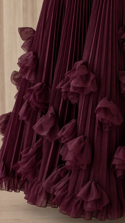 Close-up detail of sheer dimensional ruffles on pleated hem