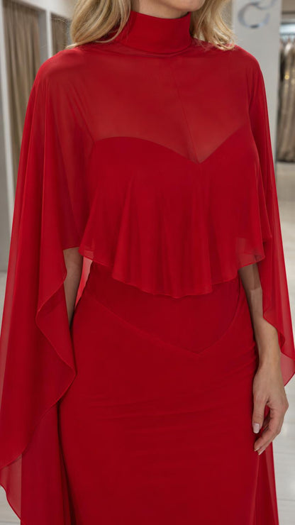 Close-up detail of mock neck and cape overlay on red dress