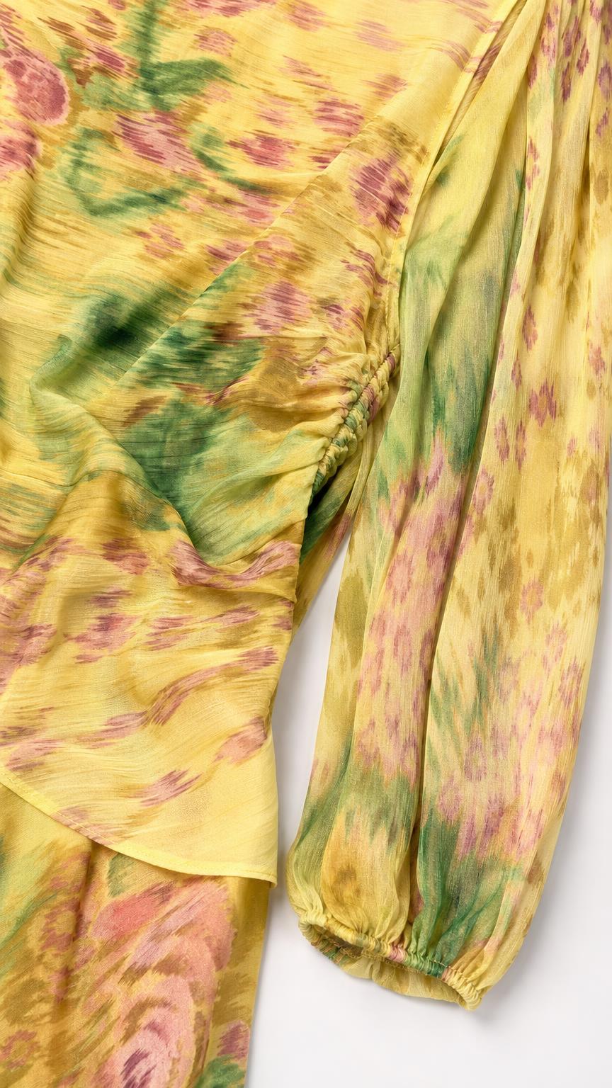 Close-up of yellow floral chiffon fabric and sleeve detail