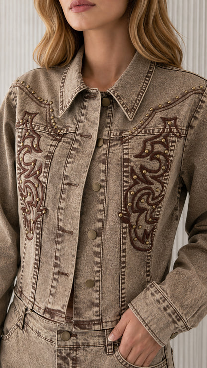 Close-up of khaki denim jacket collar and chest embroidery detail