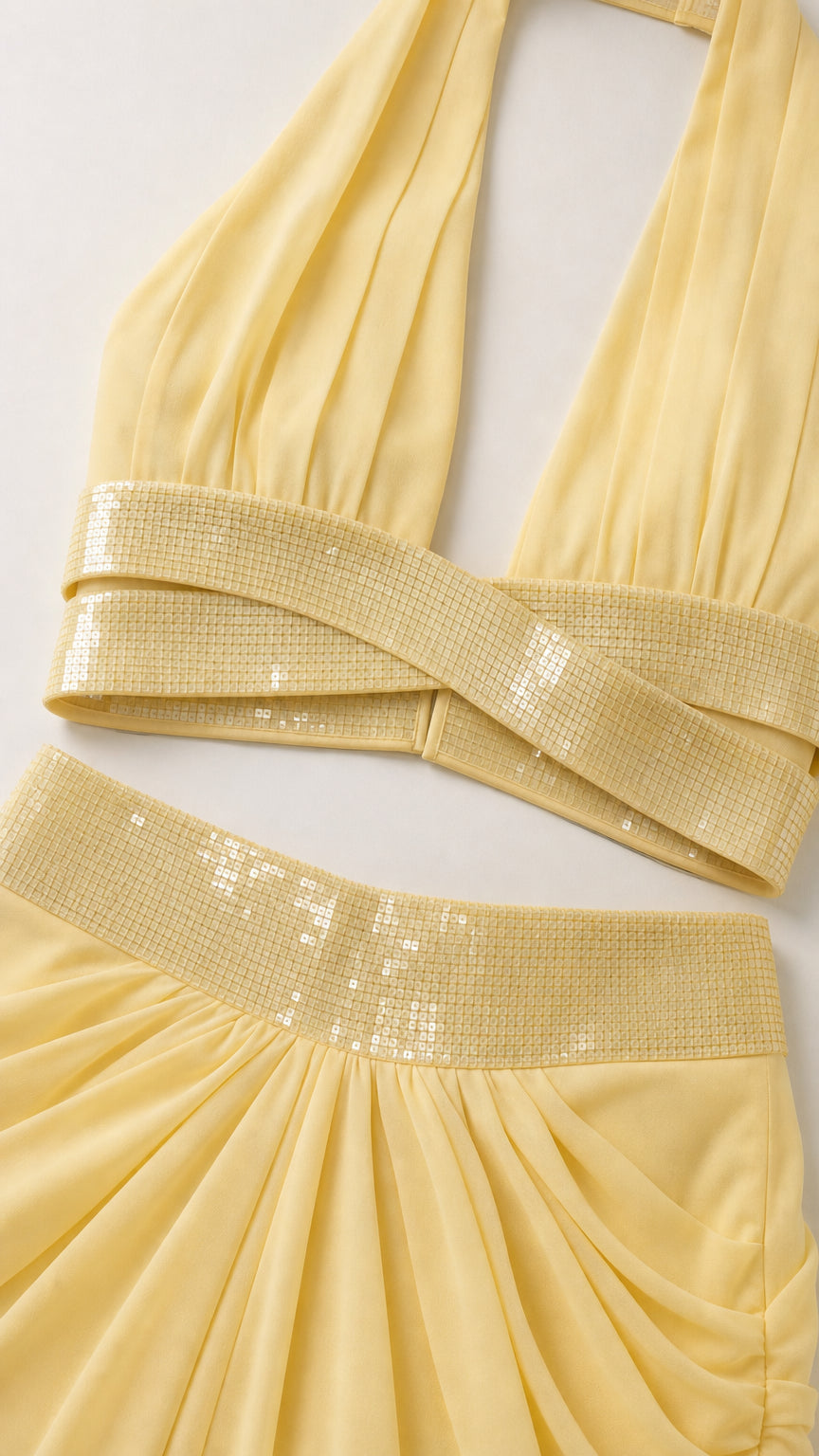 Close-up detail of yellow sequin crossover crop top and waistband