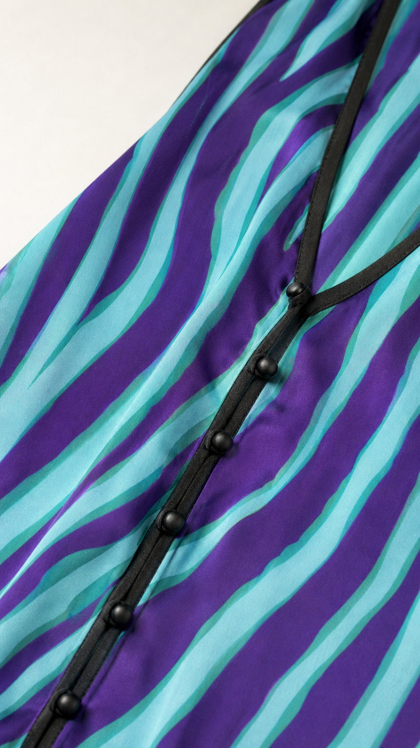 Close-up detail of center front button placket and fabric texture