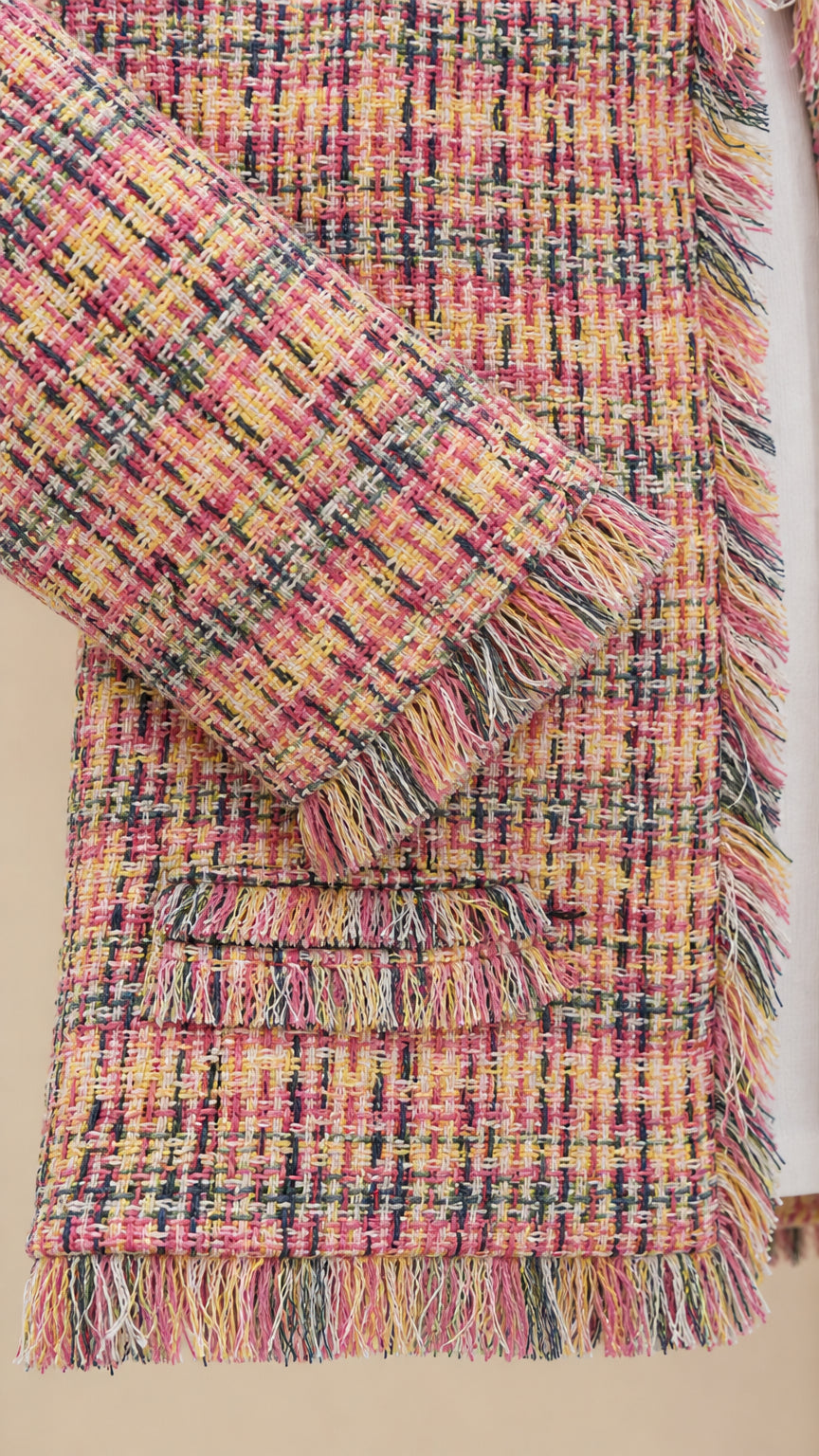 Close up of multi pink tweed jacket sleeve and fringe detail