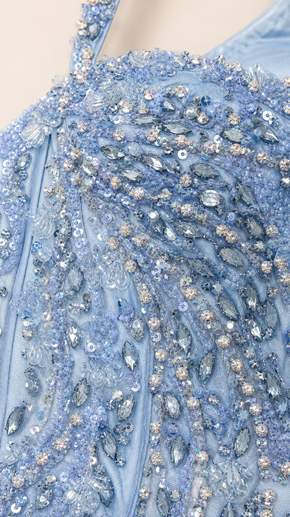 Close-up detail of light blue intricate crystal and sequin beadwork