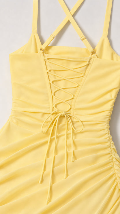Close-up of the lace-up back and adjustable straps on yellow dress