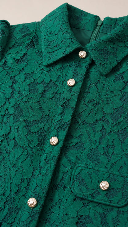 Close-up of collar, buttons, and lace texture