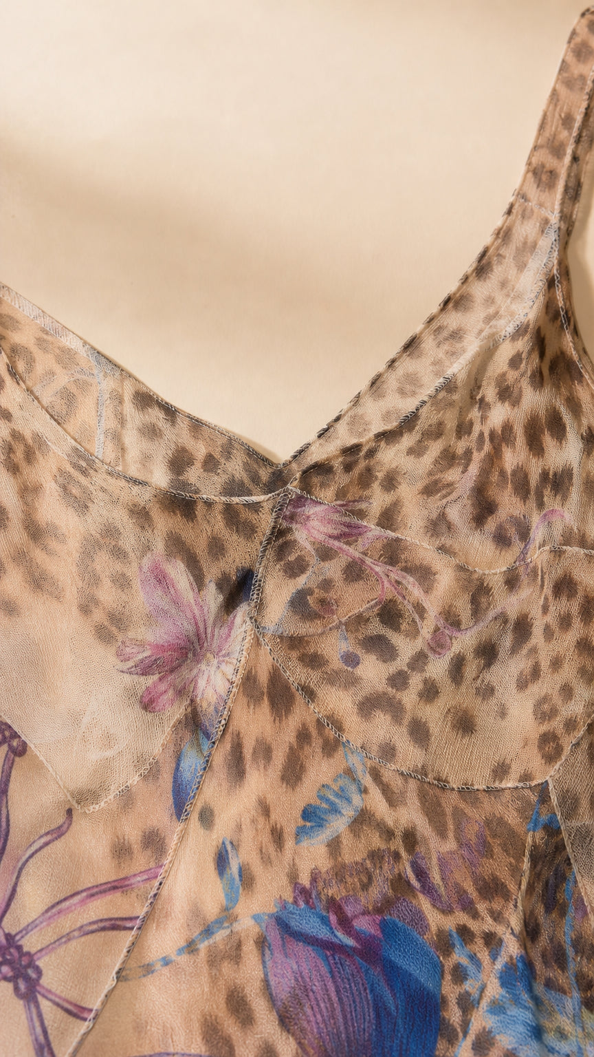 Close-up of lightweight sheer floral leopard patterned fabric and V-neckline