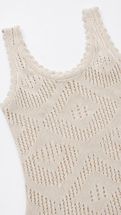 Close-up detail of neckline and open knit pattern on beige dress