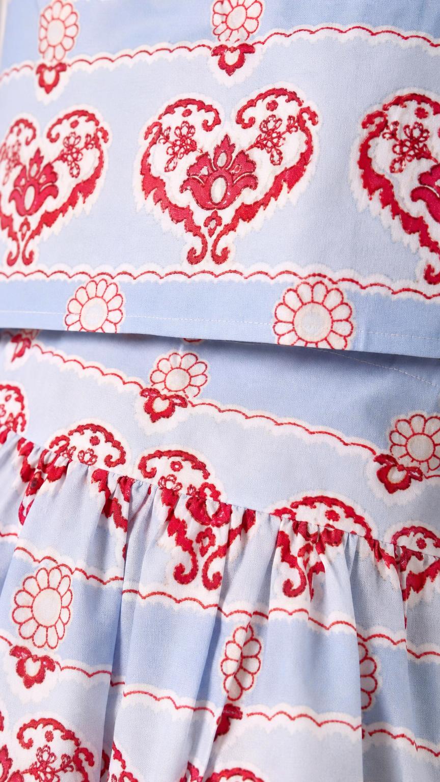 Close-up detail of fabric pattern on the light blue set