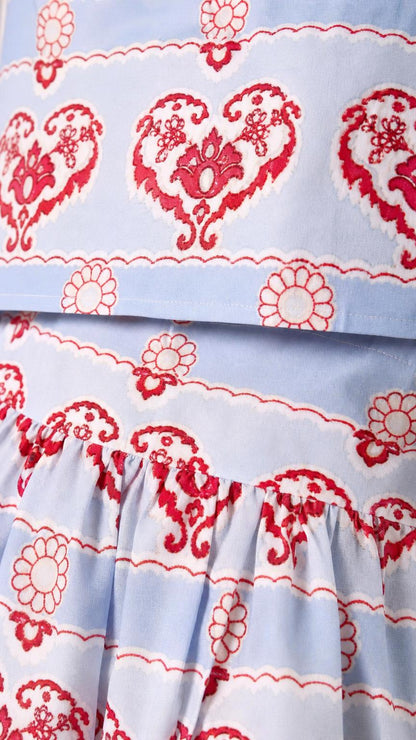 Close-up detail of fabric pattern on the light blue set