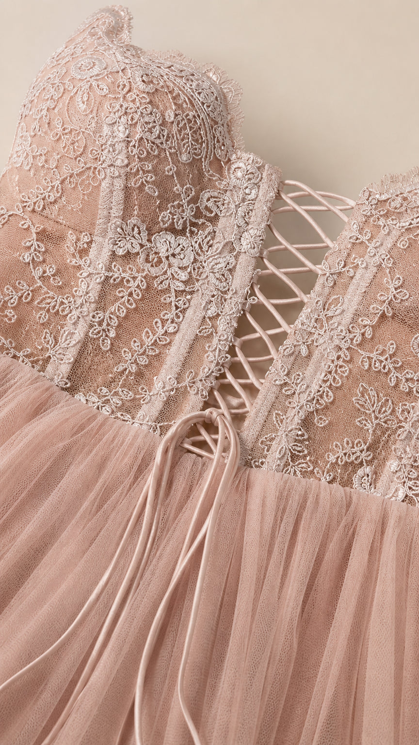 Close-up detail of embroidered bodice and lace-up back