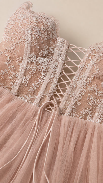 Close-up detail of embroidered bodice and lace-up back