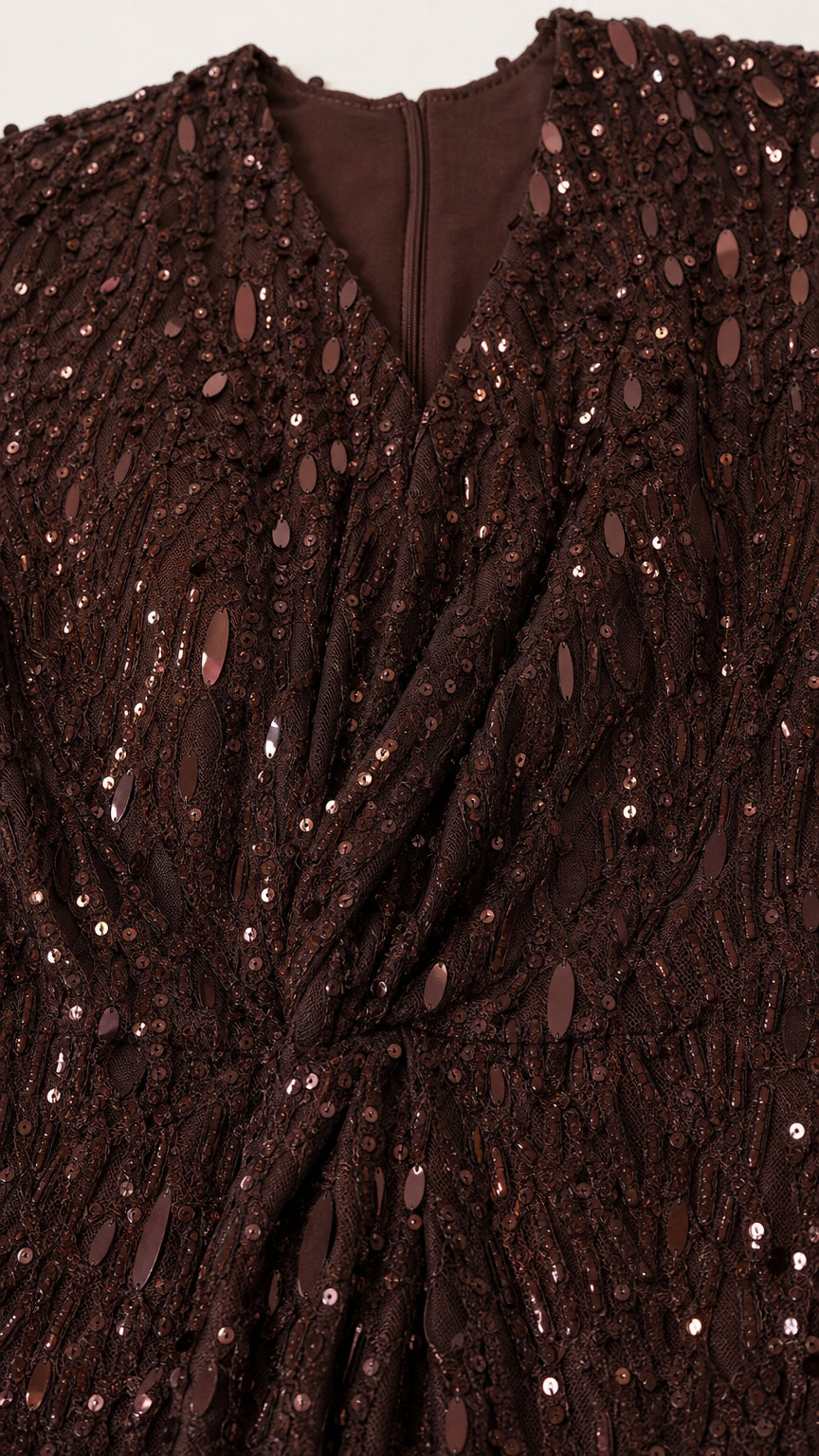 Close-up detail of V-neckline and sequin texture