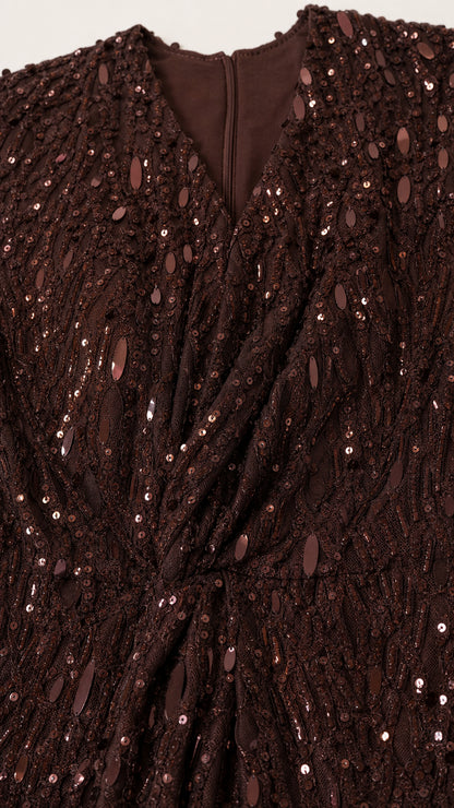 Close-up detail of V-neckline and sequin texture