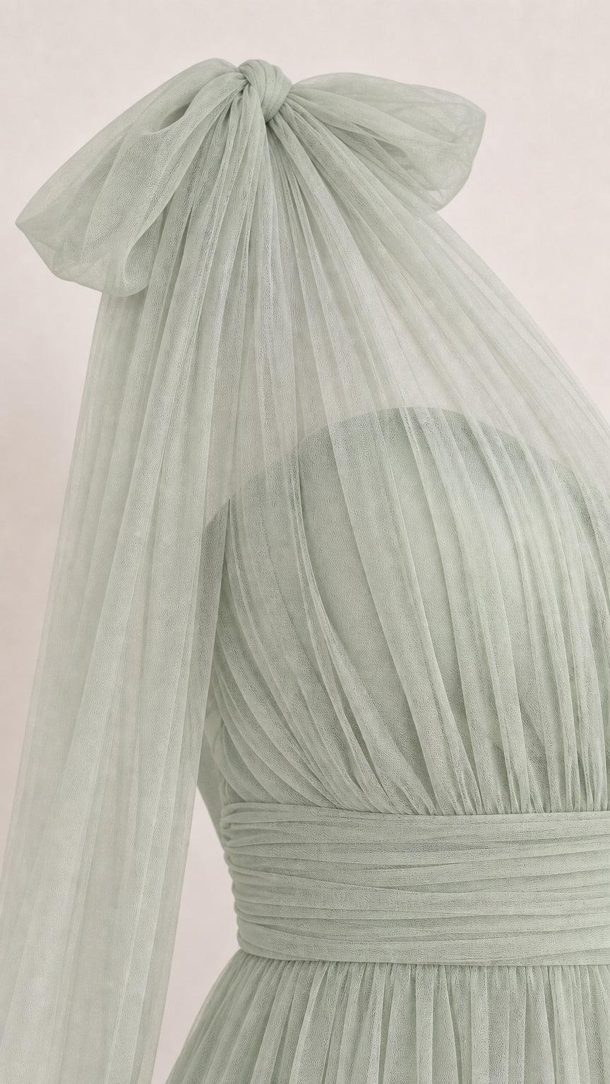 Close-up of shoulder bow and pleated tulle bodice in Sage Green