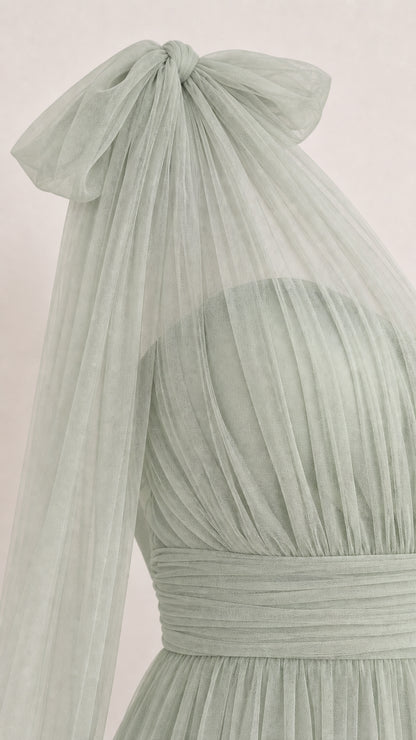 Close-up of shoulder bow and pleated tulle bodice in Sage Green