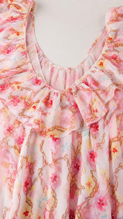 Close up of ruffle collar and scoop neckline