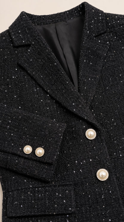 Close-up of black tweed blazer lapel and buttons