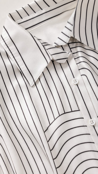 Close-up detail of the shirt collar and geometric pattern fabric