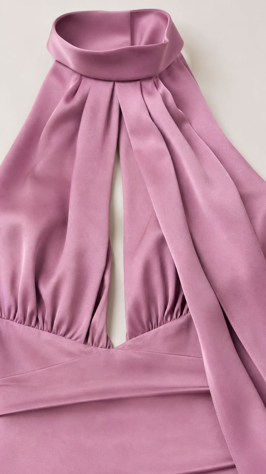 Close-up detail of halter neckline and front cutout
