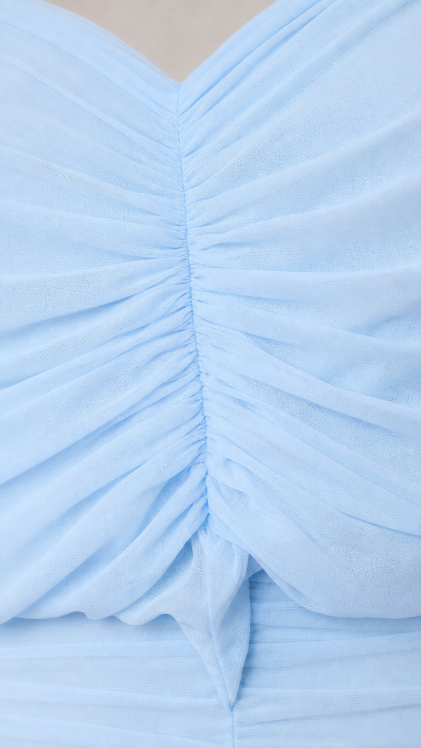 Close-up of ruched texture on baby blue dress fabric