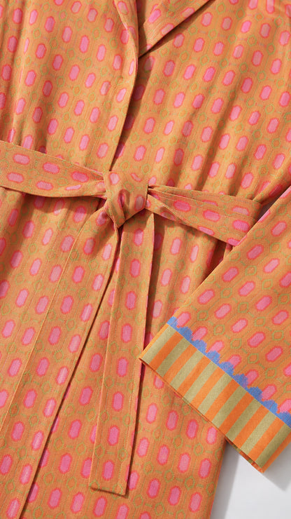 Close up of jacket belt and striped cuff detail