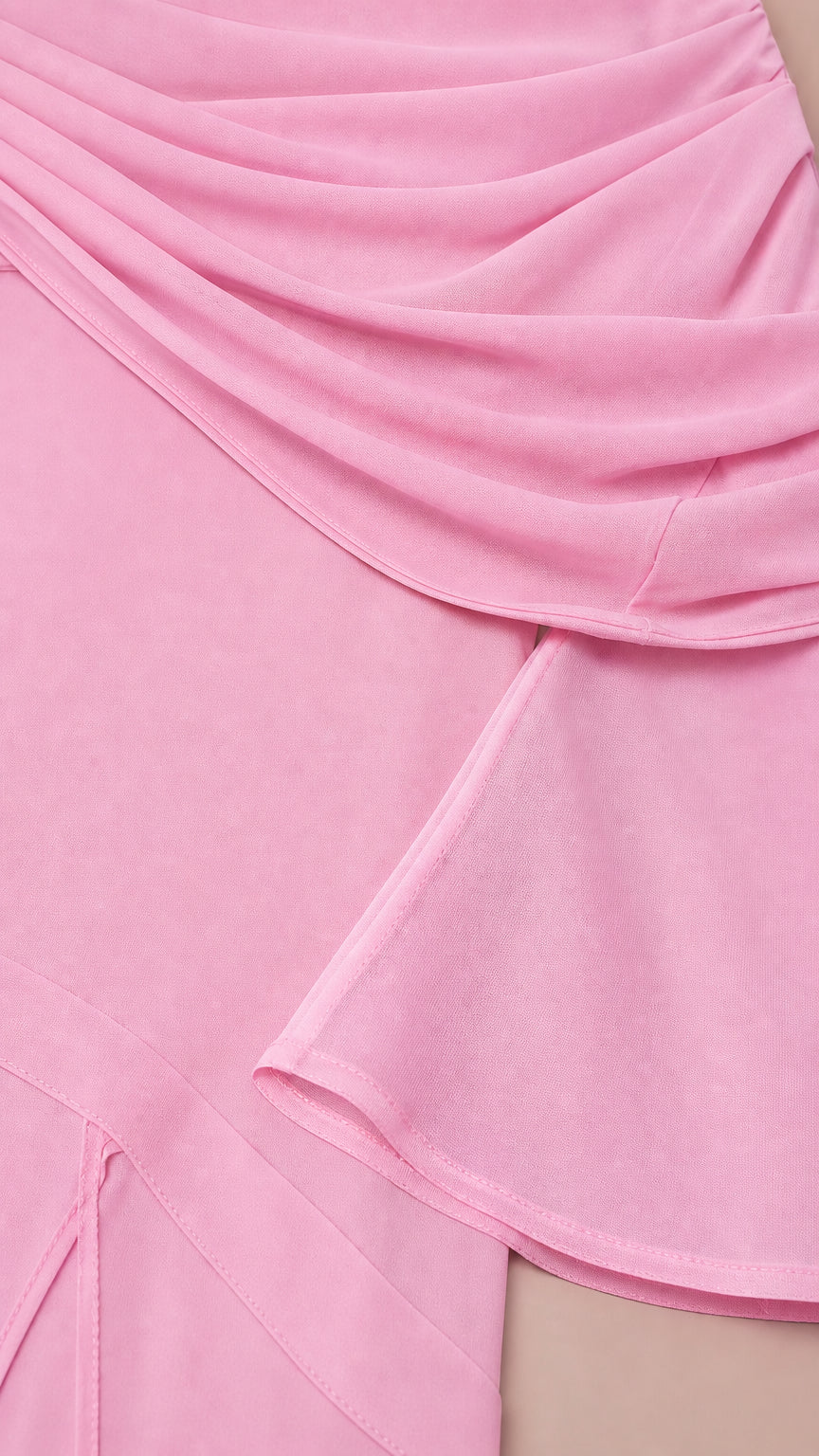 Close-up of pink draped fabric overlay and hemline detail