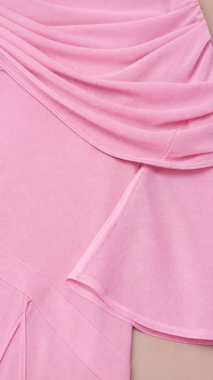 Close-up of pink draped fabric overlay and hemline detail