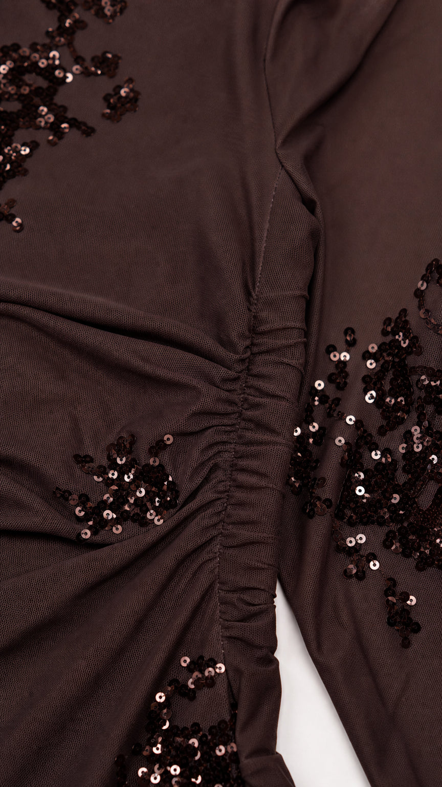Close-up of sequin embroidery and side ruching detail