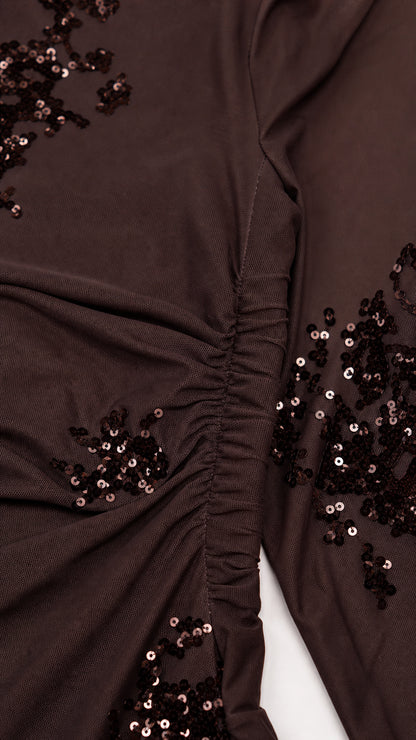 Close-up of sequin embroidery and side ruching detail