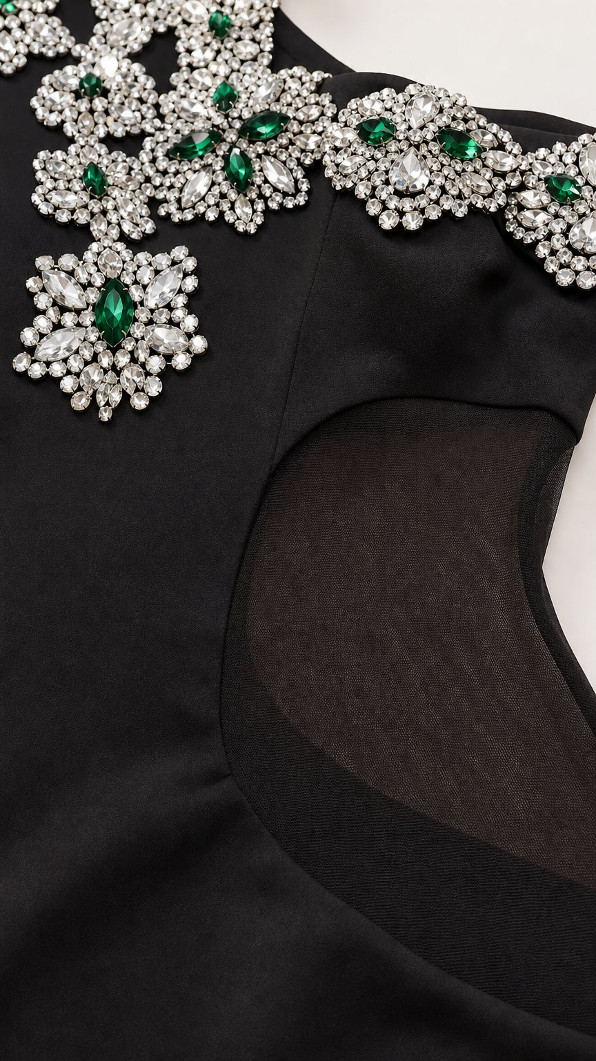 Close-up detail of rhinestone halter neckline and sheer side panel