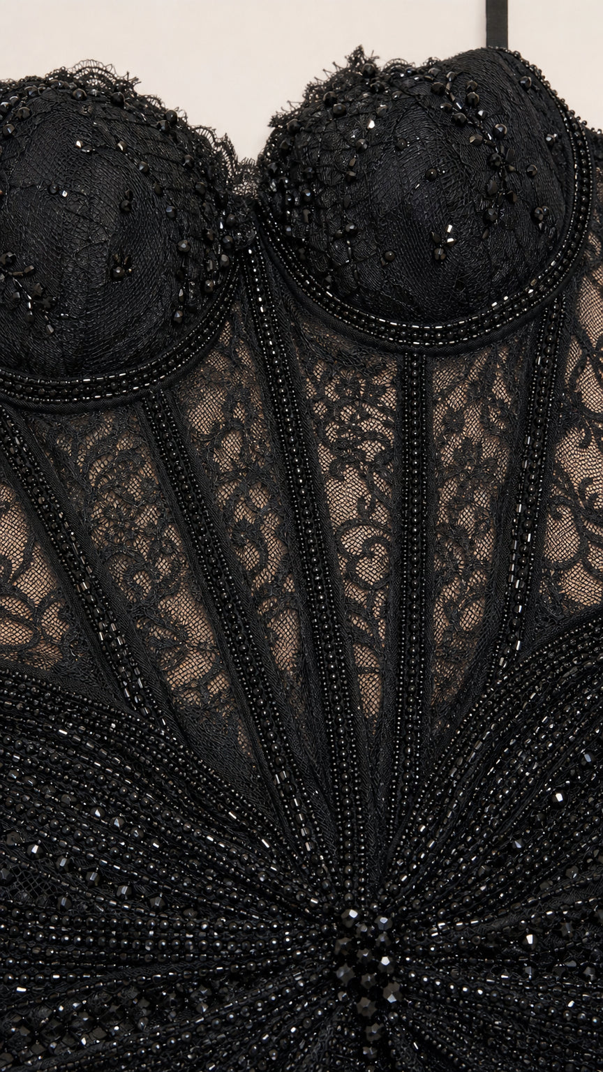 Close-up of intricate bodice beadwork and lace