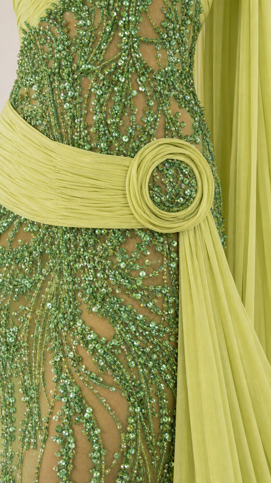 Close-up detail of beaded vine pattern and waist buckle