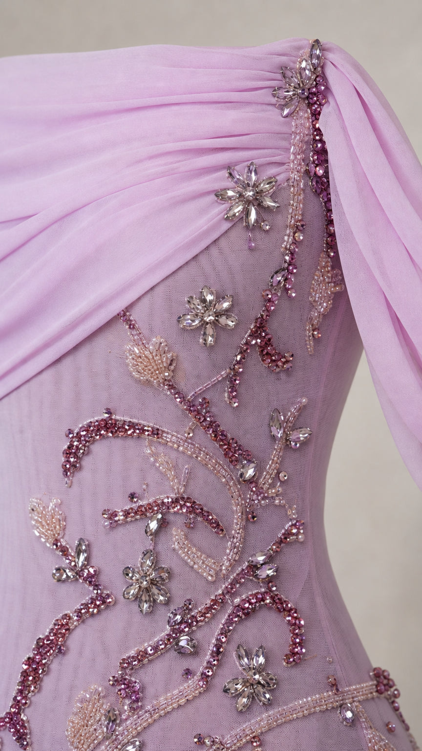 Close-up of beadwork and chiffon draping on lavender gown