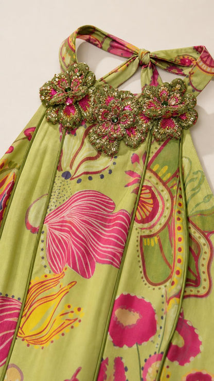 Close-up of 3D embroidered floral neckline and halter ties
