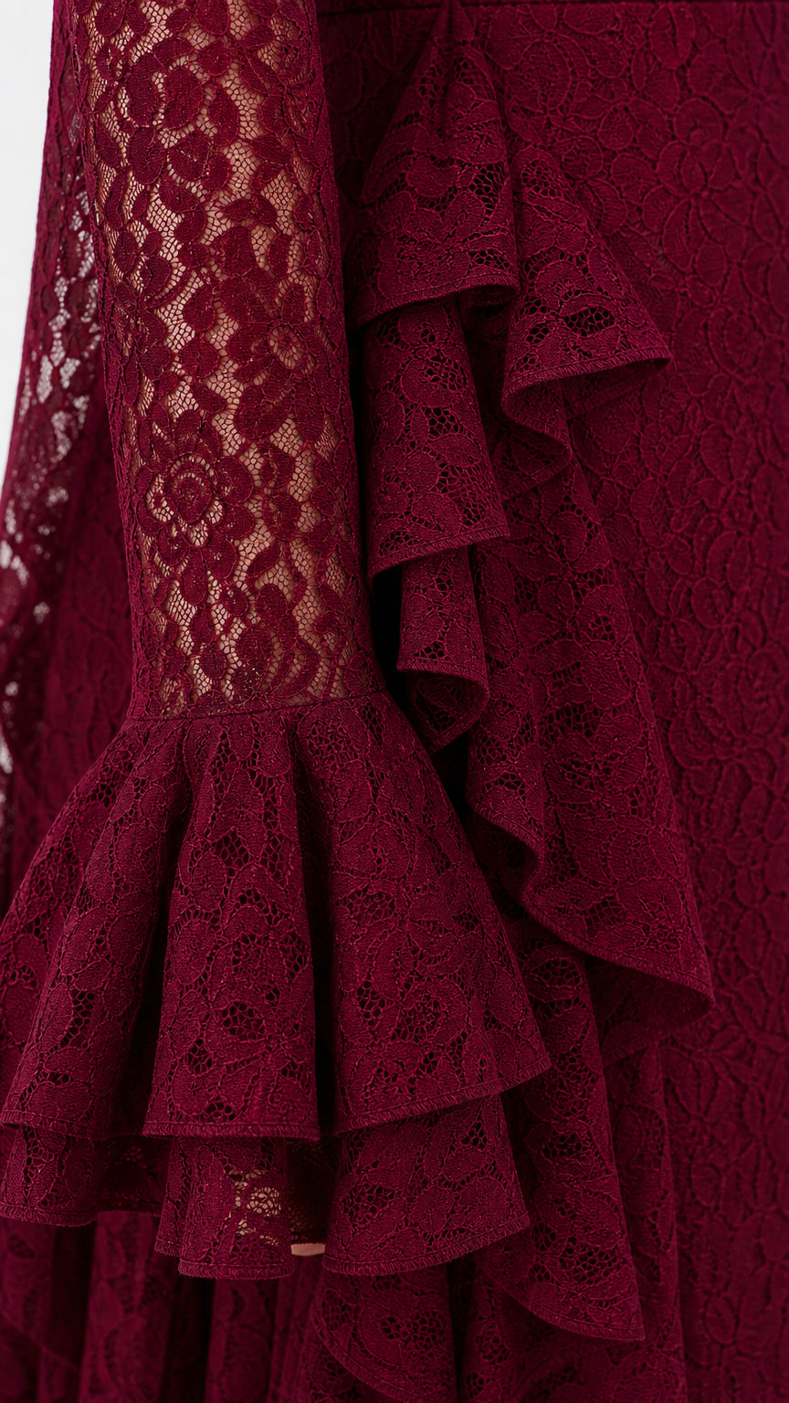 Detailed close-up of tiered flared lace cuffs on burgundy evening gown
